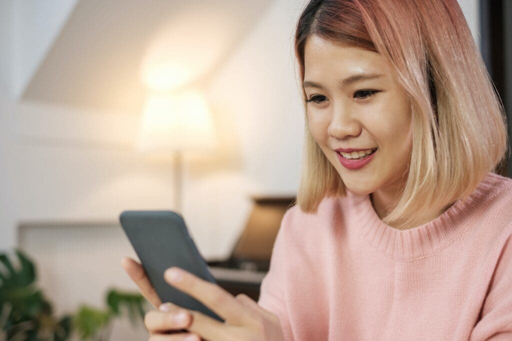 asian woman using mobile surfing internet and social media
